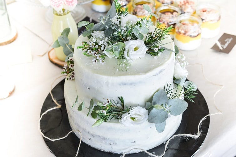 wedding cake a white plate topped with a flower on a table