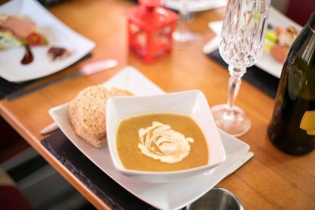 a plate of food sitting on top of a wooden table